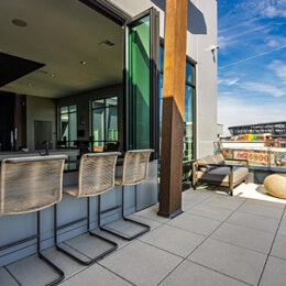 Top floor patio with bar seating area and retractable nanna windows